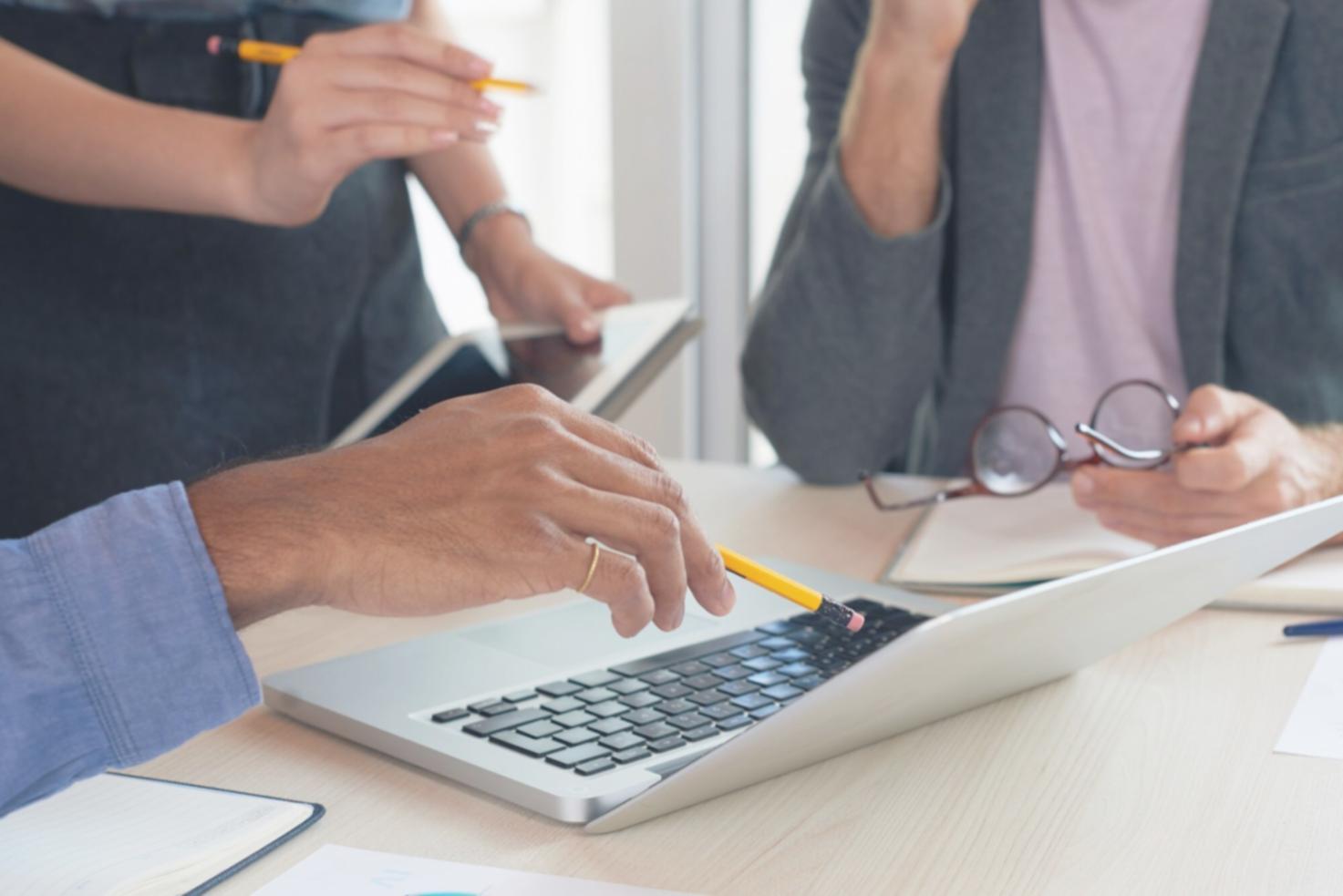 Budget negotiation training session with financial professionals analyzing data